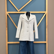 Load image into Gallery viewer, Gray coat on a mannequin against a geometric-patterned wall.