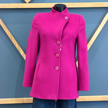 Load image into Gallery viewer, Pink coat on a mannequin against a blue wall with wooden geometric patterns
