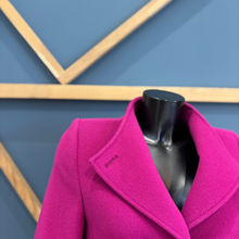 Load image into Gallery viewer, Pink coat on a mannequin against a blue geometric background