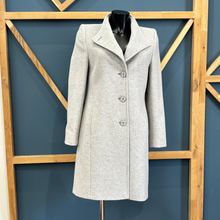 Load image into Gallery viewer, Gray coat on a mannequin against a blue wall with wooden geometric patterns