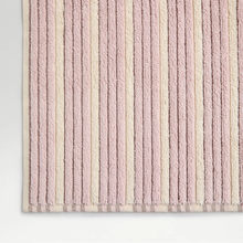 Load image into Gallery viewer, Textured towel with vertical stripes in pink and beige on a light gray background