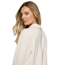Load image into Gallery viewer, Woman wearing a light-colored coat on a white background