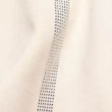 Load image into Gallery viewer, Close-up of a decorative trim with rhinestones on a beige background