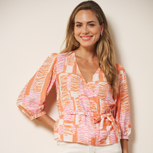 Load image into Gallery viewer, Model in Crossover top on beige background