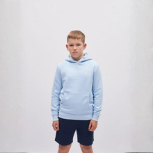 Load image into Gallery viewer, Child wearing a light blue hoodie and navy shorts on a white background