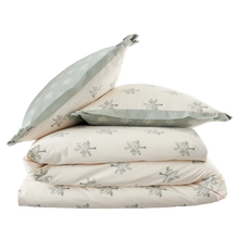 Load image into Gallery viewer, A stack of three cream-colored bedding items with a repeating gray tree pattern, including two pillows and a folded comforter or quilt, set against a plain white background.