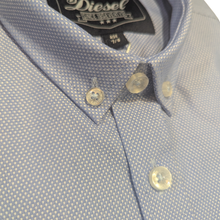 Load image into Gallery viewer, Close up image of a folded Diesel Jarlath Boys Shirt, in blue, with a white background