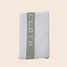 Load image into Gallery viewer, Textured white and green fabric with "Dishcloth' branding on a beige background