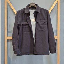 Load image into Gallery viewer, Dark jacket on a hanger against a gray background