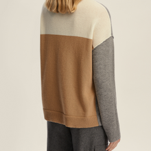 Load image into Gallery viewer, Color-blocked sweater with beige, brown, and gray sections on a neutral background