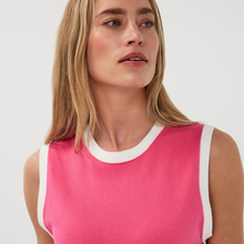 Load image into Gallery viewer, Woman wearing a pink sleeveless top with white trim on a light gray background
