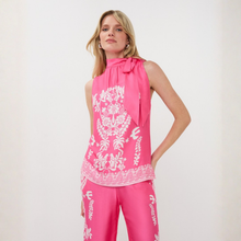 Load image into Gallery viewer, Woman wearing a pink sleeveless top and pants with white floral patterns on a white background