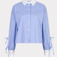 Load image into Gallery viewer, Blue and white striped shirt with tied sleeves on a light gray background