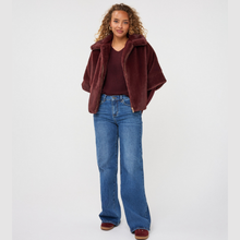 Load image into Gallery viewer, Poncho on model with jeans on pale background