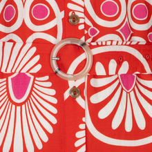 Load image into Gallery viewer, Close-up of a red fabric with white and pink abstract patterns and a belt.