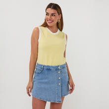 Load image into Gallery viewer, lady in lemon top and denim skirt on a pale background