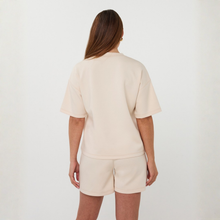 Load image into Gallery viewer, Person wearing a beige outfit with shorts on a white background
