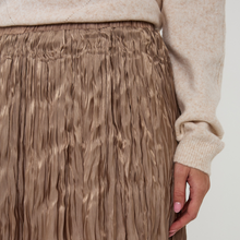 Load image into Gallery viewer, Close-up of a textured brown skirt with a neutral sweater sleeve in the background