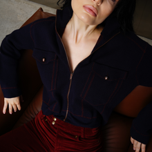 Load image into Gallery viewer, Lady in seat wearing jacket with cords