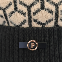 Load image into Gallery viewer, An Up-Close image of a thick beanie with beige and black geometric patterns, and featuring a black and gold logo with the letter "P"