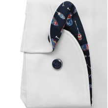 Load image into Gallery viewer, Close-up of a white coat with a navy collar featuring nautical patterns on a white background.