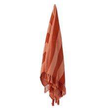 Load image into Gallery viewer, Orange striped throw with tassels on a white background