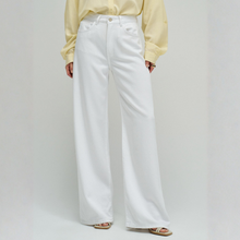 Load image into Gallery viewer, Person wearing a yellow shirt and white wide-leg pants on a plain background