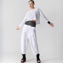 Load image into Gallery viewer, Person wearing a white outfit with black accents on a plain background