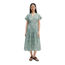 Load image into Gallery viewer, Woman wearing a green floral dress on a white background