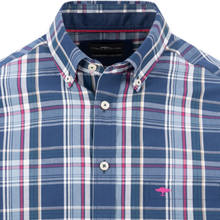 Load image into Gallery viewer, A close-up of a men's button-down shirt by Tommy Hilfiger, featuring a navy blue, white, and pink plaid pattern with the signature pink flamingo logo embroidered on the chest pocket.