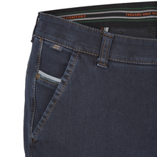 Load image into Gallery viewer, Close-up of dark blue jeans with a visible brand label on a white background
