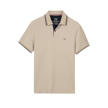 Load image into Gallery viewer, Beige polo shirt with a brand logo on a white background
