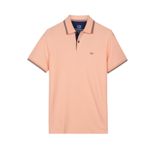 Load image into Gallery viewer, Peach-colored polo shirt with black trim on a white background
