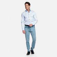Load image into Gallery viewer, Man wearing a light blue shirt and jeans on a white background