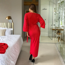 Load image into Gallery viewer, Woman in a red dress walking in a modern bedroom.