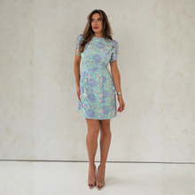 Load image into Gallery viewer, Woman in dress on light background