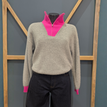 Load image into Gallery viewer, Front view of TWNS The Label Pearl Grey/Neon Pink, with a wooden and blue background.