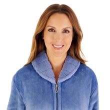 Load image into Gallery viewer, A smiling woman with brown hair wearing a blue fleece zip-up jacket with a plush collar, photographed against a plain white background.