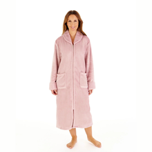 Load image into Gallery viewer, A woman modeling a plush, zip-front bathrobe in a dusty pink color, standing against a solid white background.