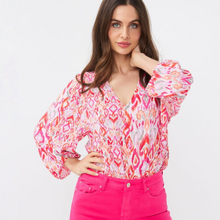 female model wearing esqualo blouse in print colour looking at camera
