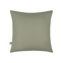 Load image into Gallery viewer, A square throw pillow in a muted sage green linen fabric, shown against a plain white background with a small brand tag on the lower left edge.