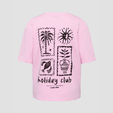 Load image into Gallery viewer, Pink t-shirt with black graphics and 'holiday club' text on a light gray background