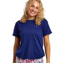 Load image into Gallery viewer, Woman wearing a blue t-shirt on a white background