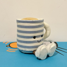 Load image into Gallery viewer, Striped mug with a face and paw on a blue surface