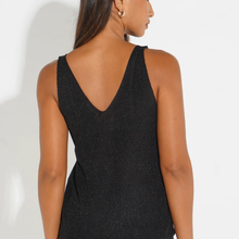 Load image into Gallery viewer, A woman shown from the back wearing a black sleeveless knit top with a deep V-neckline, photographed against a plain white studio background.