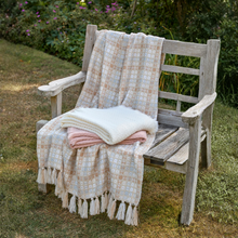 Load image into Gallery viewer, Wooden bench with plaid blanket and pink folded blanket in a garden setting