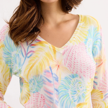 Load image into Gallery viewer, Colorful tie-dye shirt worn by a person on a white background