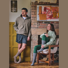 Load image into Gallery viewer, Lifestyle image of man and woman wearing socks