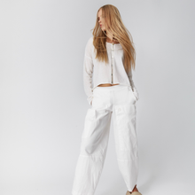 Load image into Gallery viewer, Woman wearing a white outfit on a plain background