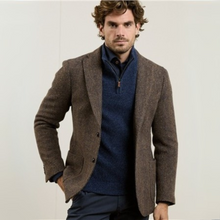 Load image into Gallery viewer, Man wearing a brown blazer over a blue sweater on a light background